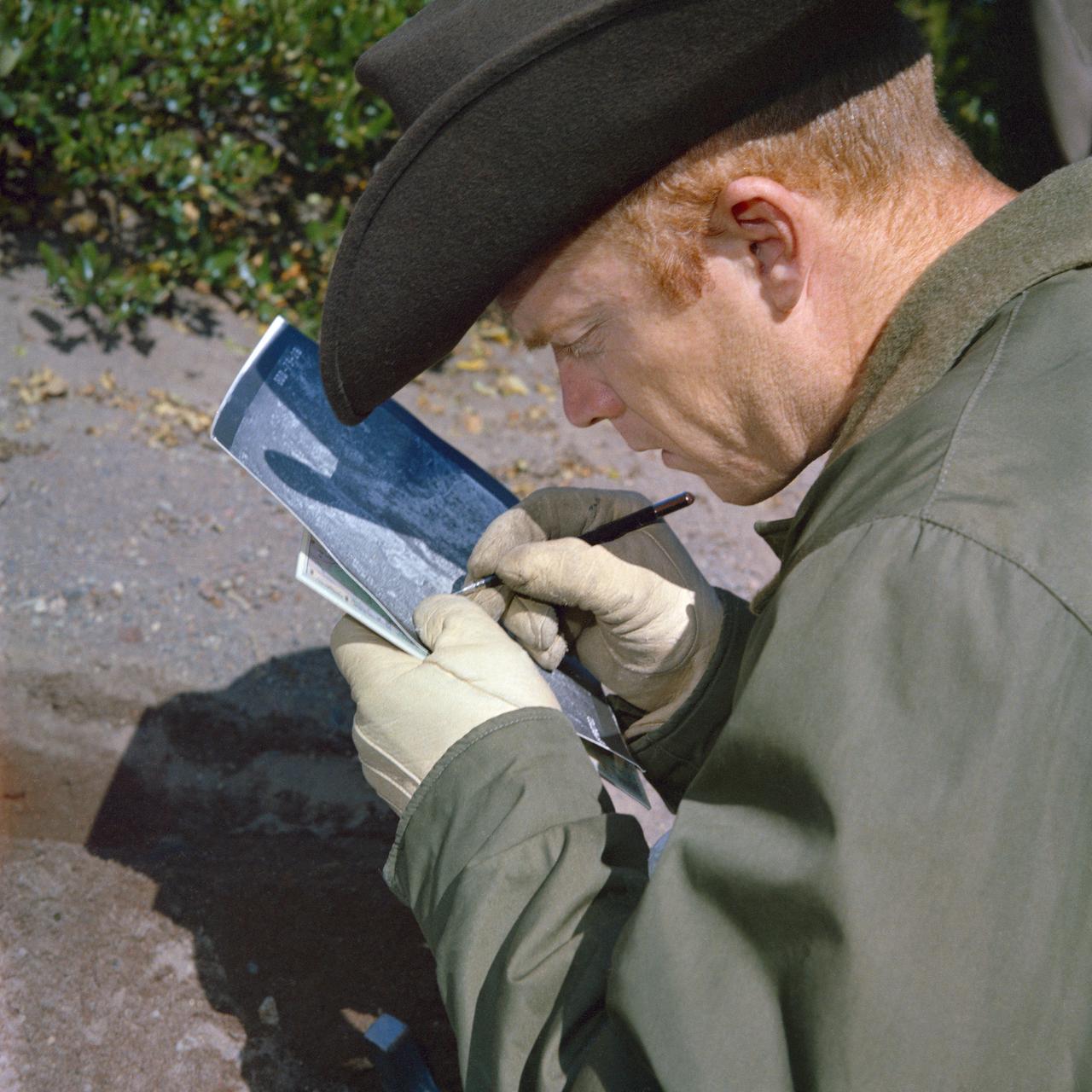 S65-51857 (September 1965) -- View of Donald A. Beattie during geological field trip with two Astronauts from the 3rd Group. Photo taken in Medicine Lake, California.