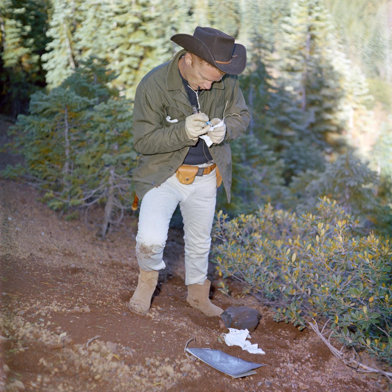 S65-51898 (September 1965) -- View of Donald A. Beattie during geological field trip with two Astronauts from the 3rd Group. Photo taken in Medicine Lake, California.