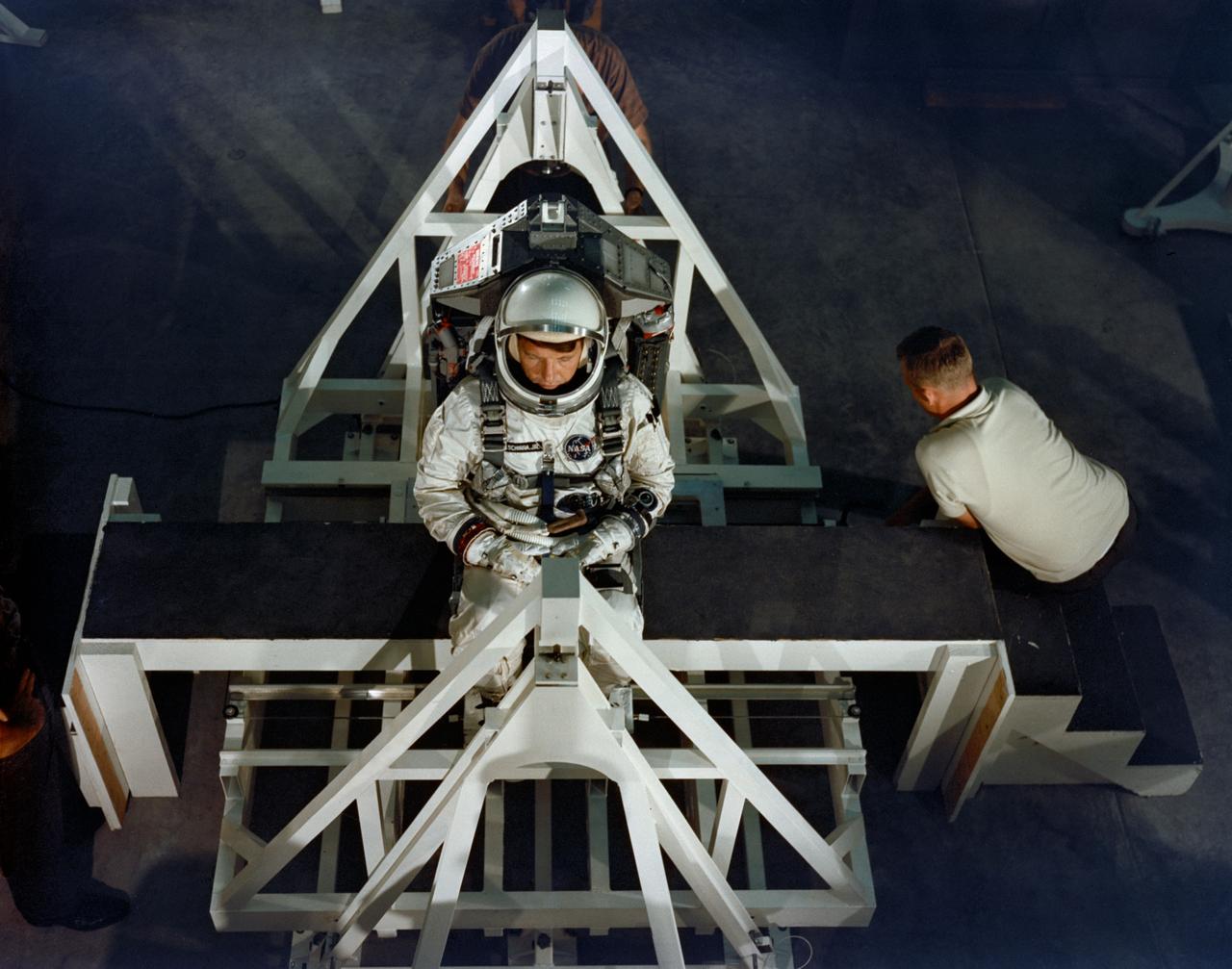 S65-54319 (22 Sept. 1965) --- Astronaut Walter M. Schirra Jr., command pilot of the Gemini-6 prime crew, undergoes weight and balance tests in the Pyrotechnic Installation Building, Merritt Island, Kennedy Space Center, Florida. Photo credit: NASA or National Aeronautics and Space Administration