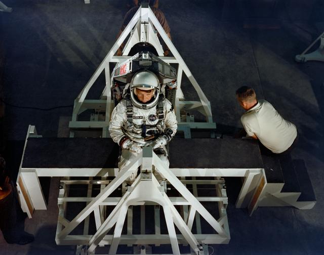 NASA image: Astronaut Walter Schirra during weight and balance test