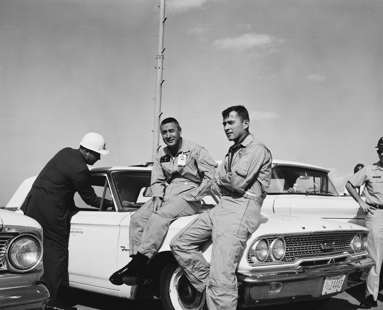 Astronauts Young and Virgil I. Grissom relax on the day of the proposed Gemini 6 Mission.               CAPE KENNEDY, FL