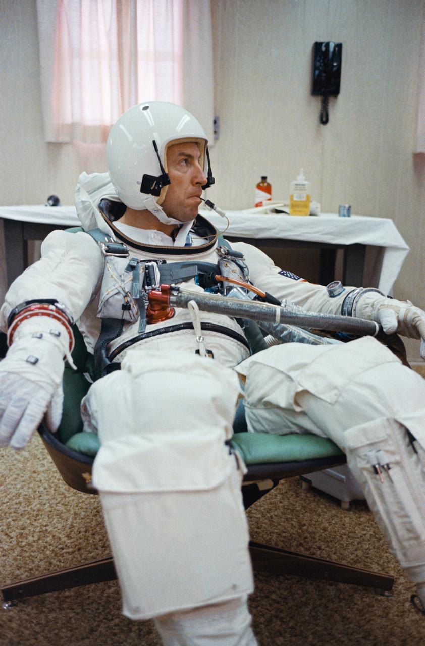 S65-59934 (4 Dec. 1965) --- Gemini-7 pilot James A. Lovell Jr. has a temperature check with an oral temperature probe attached to his spacesuit during a final preflight preparations for the Gemini-7 space mission. The National Aeronautics and Space Administration has planned a 14-day mission for the Gemini-7. The temperature probe allows doctors to monitor astronauts' body temperature at any time during the mission. Photo credit: NASA