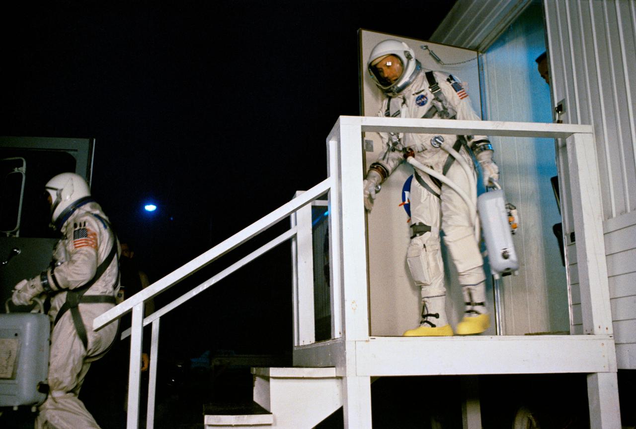 S65-59974 (15 Dec. 1965) --- Astronauts Walter M. Schirra Jr. (leading), command pilot; and Thomas P. Stafford, pilot, leave the suiting trailer at Launch Complex 16 during the Gemini-6 prelaunch countdown at Cape Kennedy, Florida. They entered a special transport van which carried them to Pad 19 and their spacecraft. Gemini-6 lifted off at 8:37 a.m. (EST) on Dec. 15, 1965. Photo credit: NASA or National Aeronautics and Space Administration