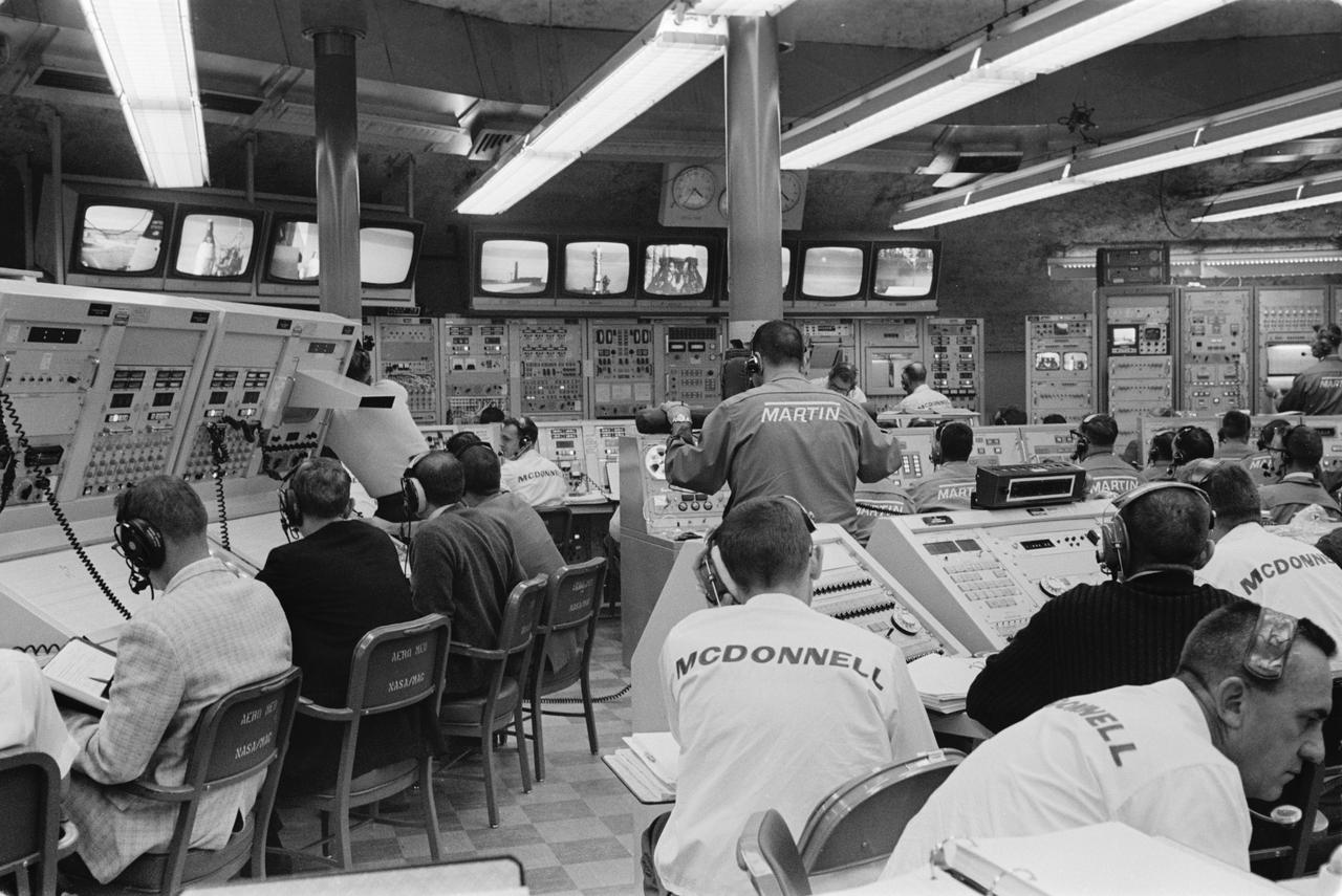S65-61804 (15 Dec. 1965) --- Overall view of activity in blockhouse at Launch Complex 19 during the final moments of the Gemini-6 prelaunch countdown. The Gemini-6 spacecraft and launch vehicle at Pad 19 are seen on television monitors above consoles. In the spacecraft awaiting liftoff were astronauts Walter M. Schirra Jr., command pilot; and Thomas P. Stafford, pilot. The National Aeronautics and Space Administration successfully launched Gemini-6 at 8:37 a.m.  (EST) on Dec. 15, 1965, on a two-day mission in space. An attempt will be made to rendezvous Gemini-6 with Gemini-7. Photo credit: NASA or National Aeronautics and Space Administration