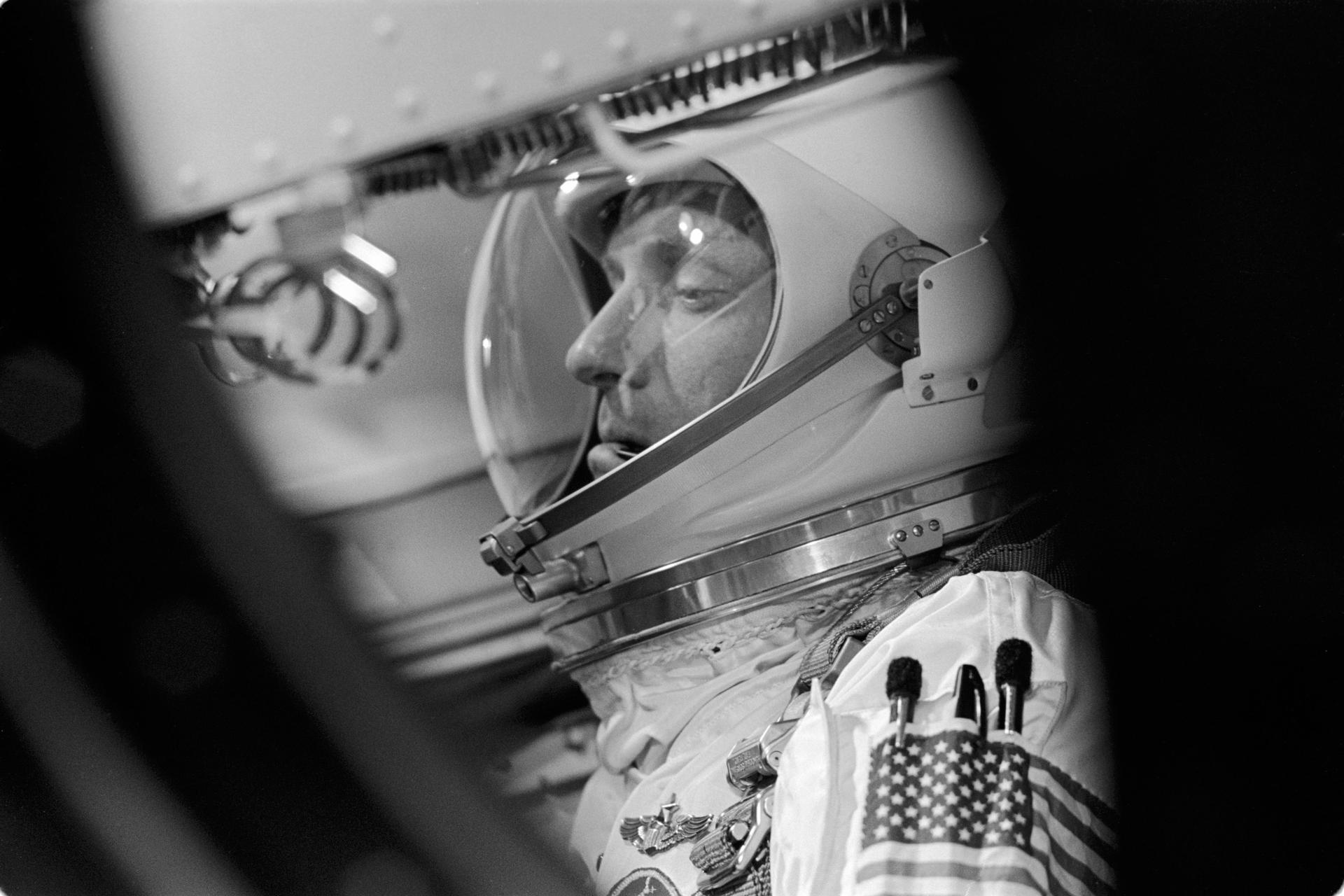 Gemini astronaut Tom Stafford seen through the spacecraft window during a prelaunch activity