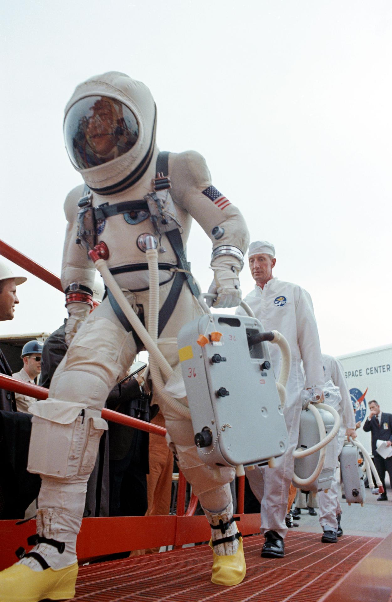 Jim Lovell and Frank Borman walk out to the elevator for their Gemini VII flight