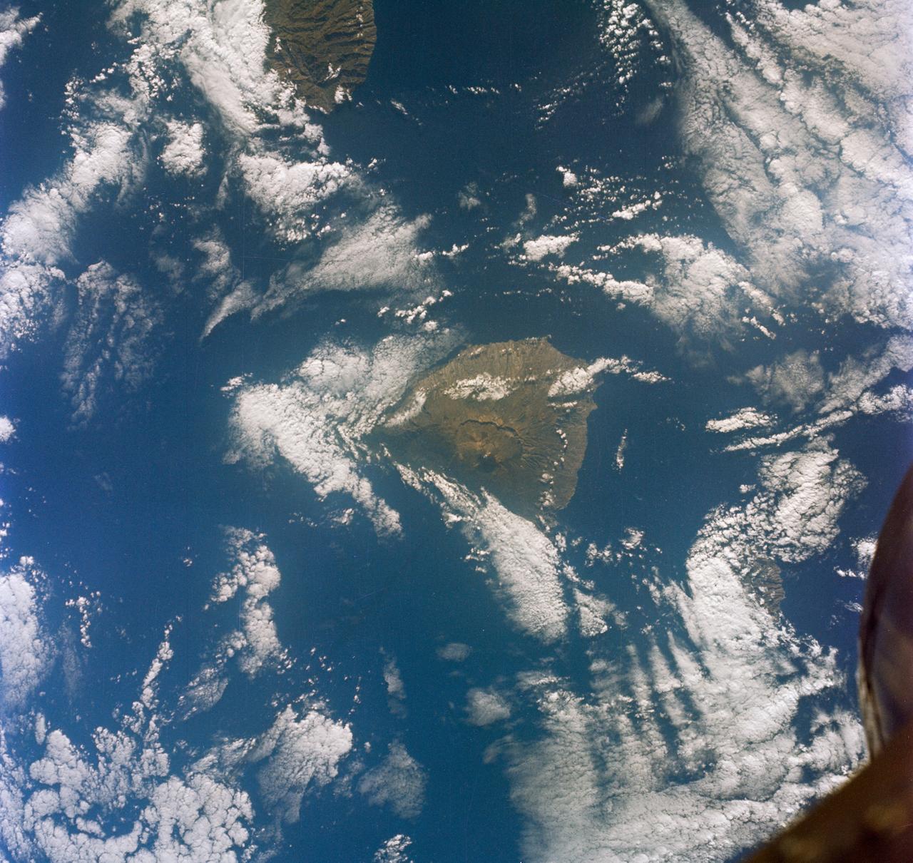 S65-63150 (16 Dec. 1965) --- Eddies in stratocumulus clouds over the Canary Islands as seen from the Gemini-6 spacecraft during its 14th revolution of Earth. Photo credit: NASA or National Aeronautics and Space Administration