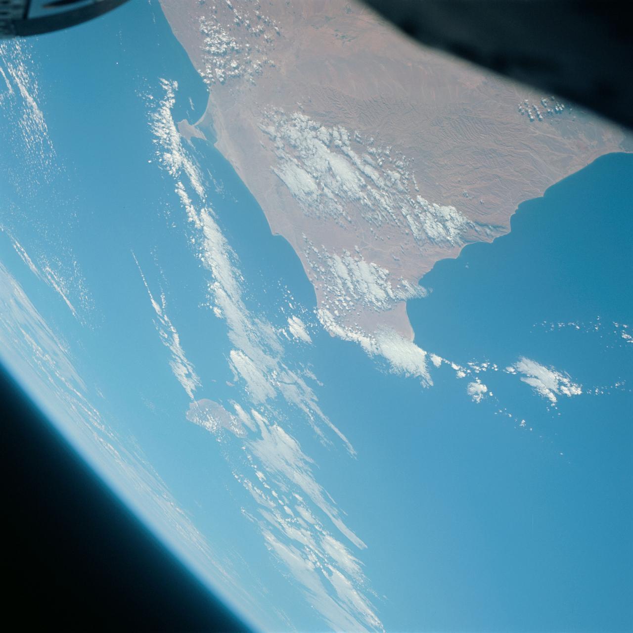 S65-63766 (12 Dec. 1965) --- Ras Azir on the coast of the Republic of Somali, looking east, as seen from the National Aeronautics and Space Administration's Gemini-7 spacecraft during its 117th revolution of Earth. Taken with a modified 70mm Hasselblad camera, using Eastman Kodak, Ektachrome MS (S.O. 217) color film. Photo credit: NASA