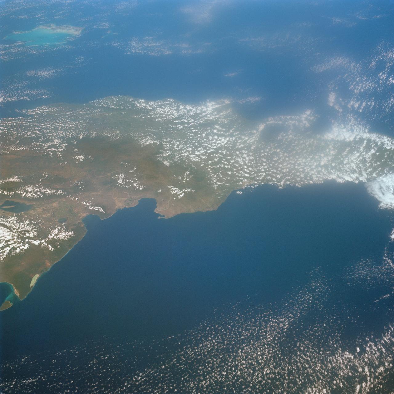 S65-63926 (16 Dec. 1965) --- Island of Hispaniola, Dominican Republic end, as seen from the National Aeronautics and Space Administration's Gemini-7 spacecraft during its 179th revolution of Earth. North is toward the left of the picture. This photograph was taken with a modified 70mm Hasselblad camera, using Eastman Kodak, Ektachrome MS (S.O. 217) color film. Photo credit: NASA