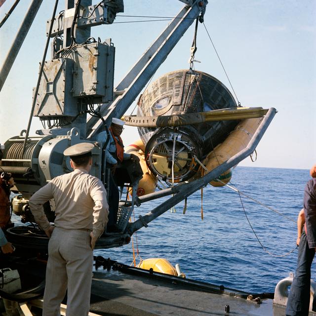 NASA image: GEMINI-TITAN (GT)-8 - RECOVERY - SPACECRAFT (S/C) HOISTED ABOARD - PACIFIC