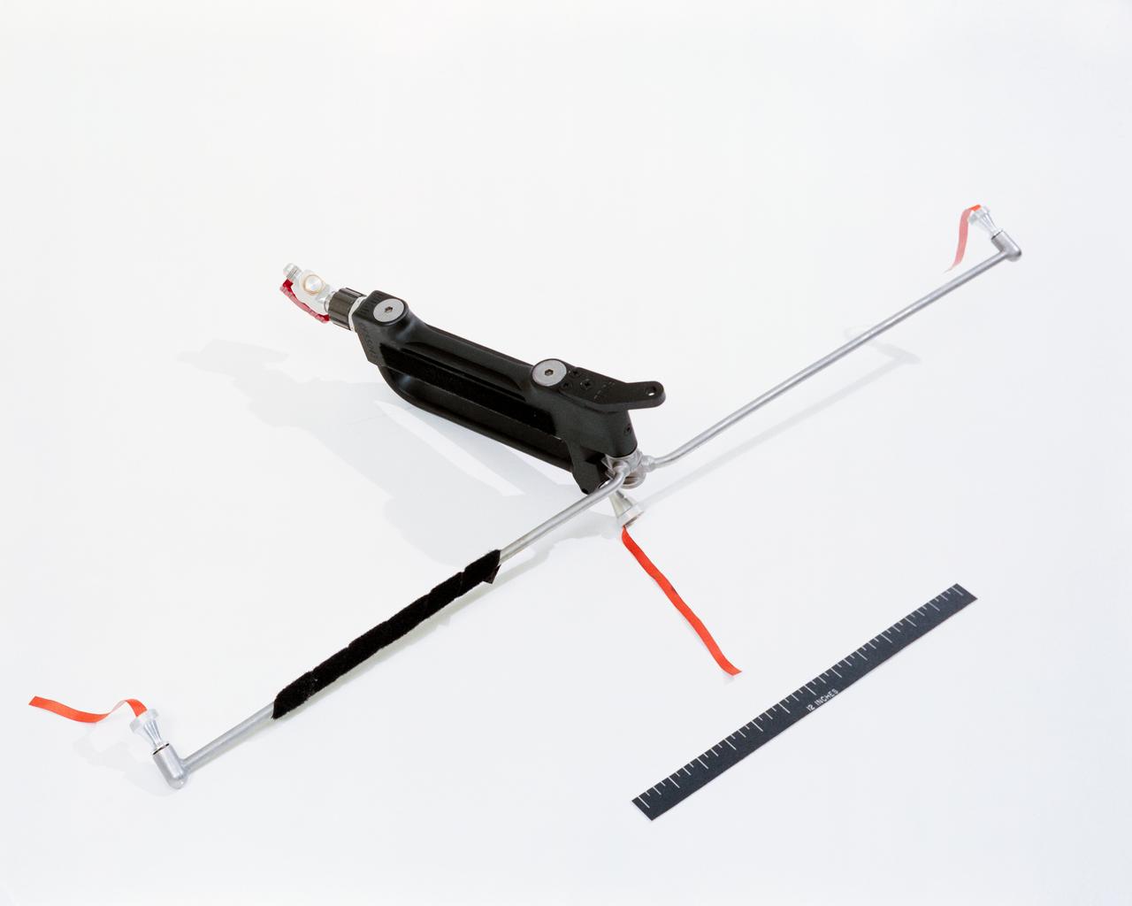 S66-19184 (1966) --- Close-up view of the Hand Held Maneuvering Unit which will be used by astronaut David R. Scott during the extravehicular activity on the Gemini-8 spaceflight. High pressure cold gas released through the unit's nozzles produces the required controlled thrust to maneuver in a zero-gravity environment. Photo credit: NASA