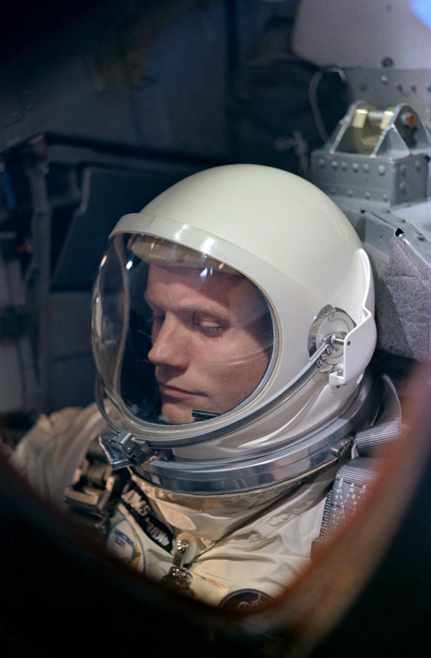 S66-24489 (16 March 1966) --- Close-up view of astronaut Neil A. Armstrong, command pilot of the Gemini-8 spaceflight, making final adjustments and checks in the spacecraft during the Gemini-8 prelaunch countdown. Photo credit: NASA