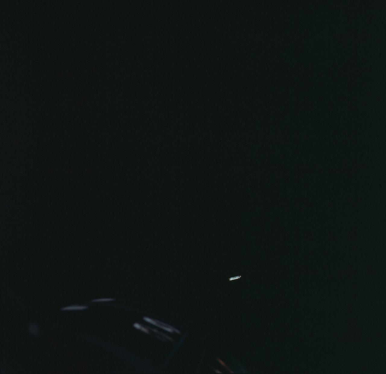S66-25774 (16 March 1966) --- The Agena Target Docking vehicle seen from the Gemini-8 spacecraft during rendezvous in space. The Agena is approximately 1,000 feet away from the nose of the spacecraft (lower left). Photo credit: NASA