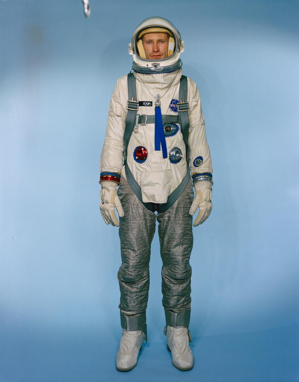 S66-31019 (May 1966) --- Test subject Fred Spross, Crew Systems Division, wears the Gemini-9 configured extravehicular spacesuit assembly. The legs are covered with Chromel R, which is a cloth woven from stainless steel fibers, used to protect the astronaut and suit from the hot exhaust thrust of the Astronaut Maneuvering Unit (AMU). Astronaut Eugene A. Cernan will wear this spacesuit during his Gemini-9A extravehicular activity (EVA). Photo credit: NASA