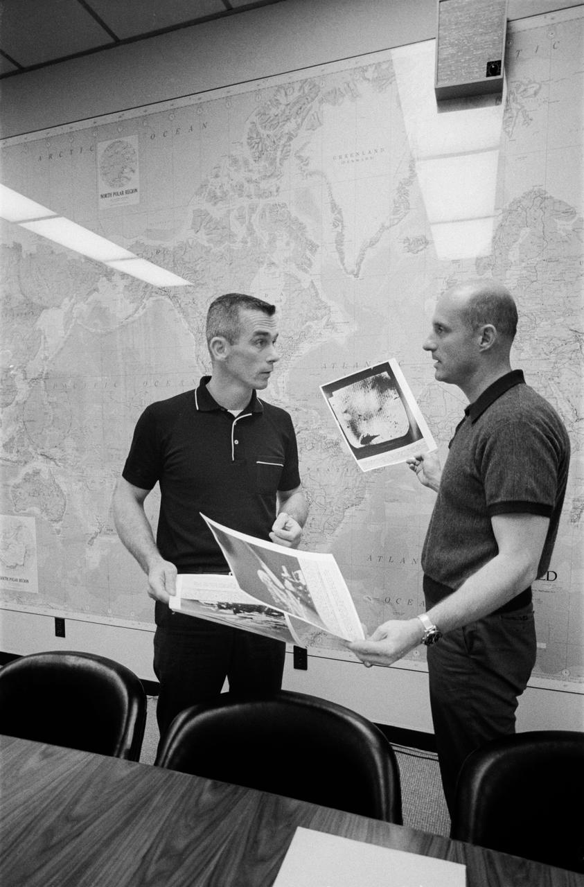 S66-32144 (2 June 1966) --- Astronauts Thomas P. Stafford (right) and Eugene A. Cernan look over pictures of the lunar surface taken by Surveyor I. Photo credit: NASA