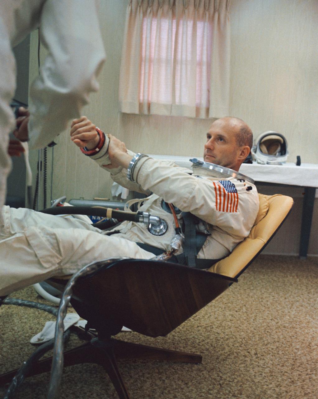 S66-34060 (3 June 1966) --- Astronaut Thomas P. Stafford, Gemini-9A prime crew command pilot, adjusts a sleeve of his spacesuit during suiting up procedures at Launch Complex 16, Kennedy Space Center. The Gemini-9A liftoff was at 8:39 a.m. (EST), June 3, 1966. Photo credit: NASA