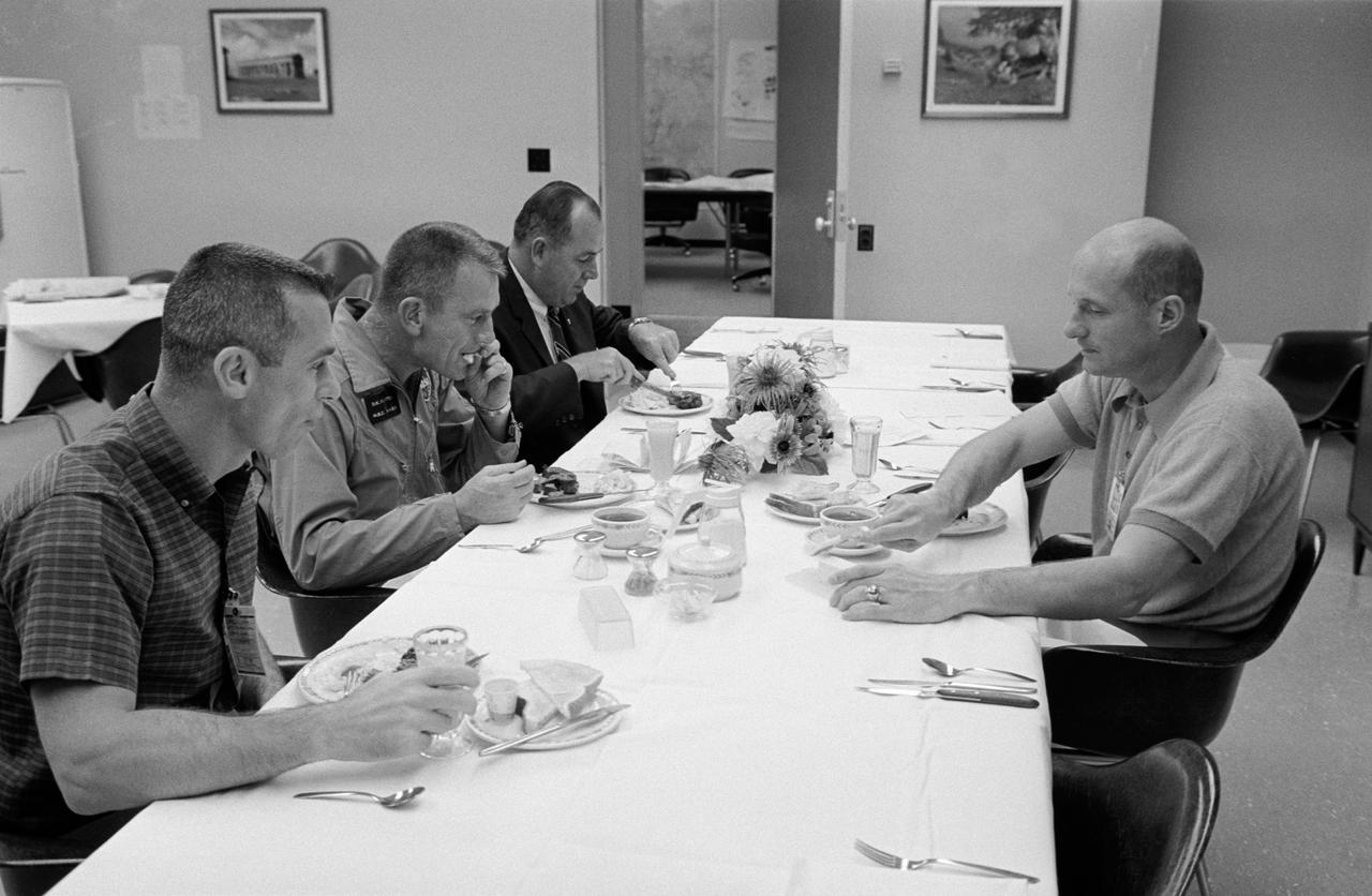 S66-34069 (3 June 1966) --- Gemini-9A prime crew enjoy a breakfast of steak and eggs on the morning of the Gemini-9A launch. Left to right, are astronaut Eugene A. Cernan, pilot; Donald K. Slayton, MSC Director of Flight Crew Operations; Charles Buckley, KSC Security; and astronaut Thomas P. Stafford, command pilot. Photo credit: NASA