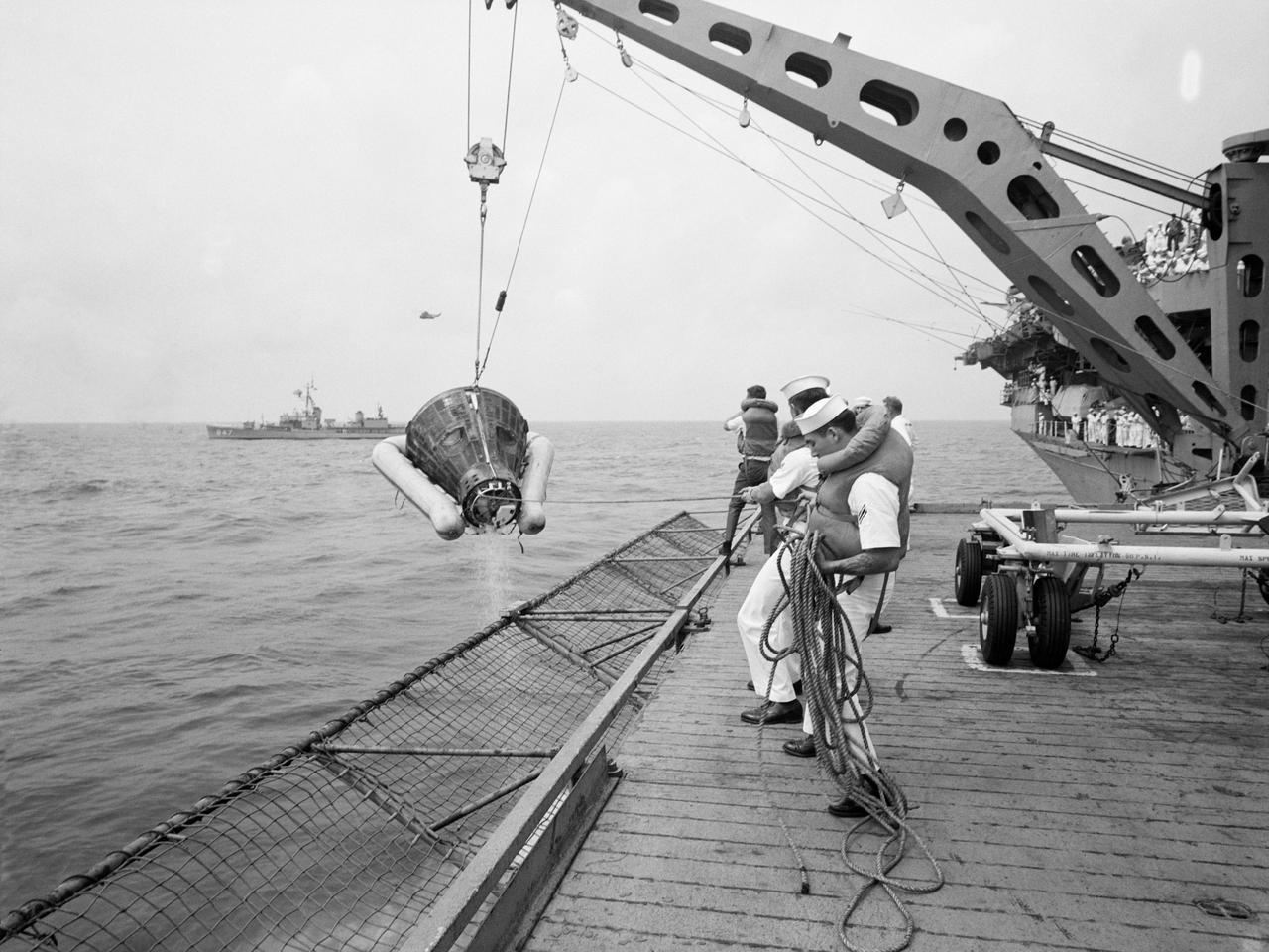 S66-34101 (6 June 1966) --- The Gemini-9 spacecraft, with astronauts Thomas P. Stafford and Eugene A. Cernan still inside, is hoisted aboard the aircraft carrier USS Wasp. Gemini-9 splashed down only 3.5 miles from the big recovery ship at 9 a.m. (EST), June 6, 1966, 345 miles east of Cape Kennedy, to conclude a 72-hour, 21-minute mission in space. Photo credit: NASA