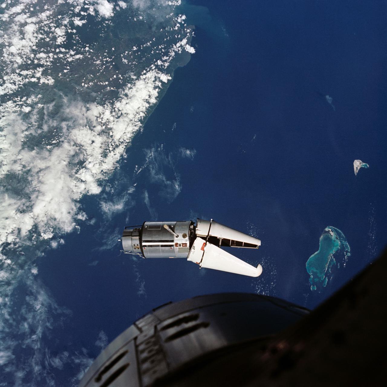 S66-37923 (3 June 1966) --- The Augmented Target Docking Adapter (ATDA) as seen from the Gemini-9 spacecraft during one of their three rendezvous in space. The ATDA and Gemini-9 spacecraft are 66.5 feet apart. Failure of the docking adapter protective cover to fully separate on the ATDA prevented the docking of the two spacecraft. The ATDA was described by the Gemini-9 crew as an "angry alligator." Photo credit: NASA