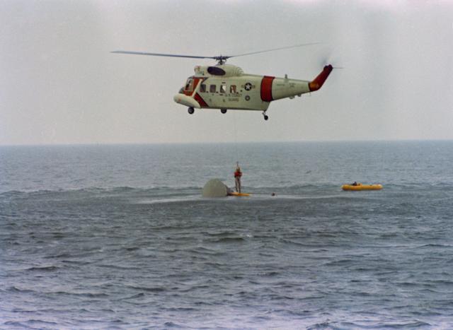 NASA image: Astronaut John Young hoisted aboard helicopter during water egress training