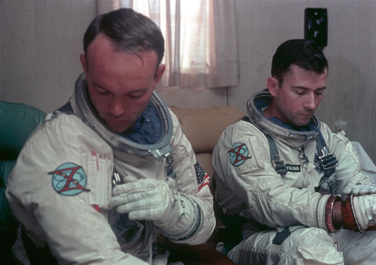 S66-42424 (18 July 1966) --- Astronauts John W. Young (right), command pilot, and Michael Collins (left), pilot, prime crew for the Gemini-10 spaceflight, undergo suiting up operations in the Launch Complex 16 suiting trailer. Photo credit: NASA