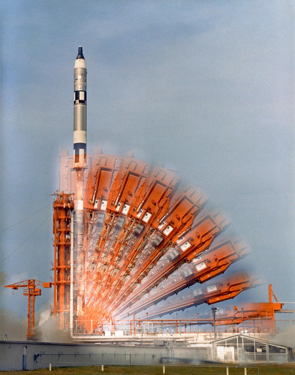S66-42762 (18 July 1966) --- The Gemini-10 spacecraft is launched from Complex 19 at 5:20 p.m., July 18, 1966. A time exposure creates the illusion of multiple rocker arms. Onboard are astronauts John W. Young, command pilot, and Michael Collins, pilot. Photo credit: NASA