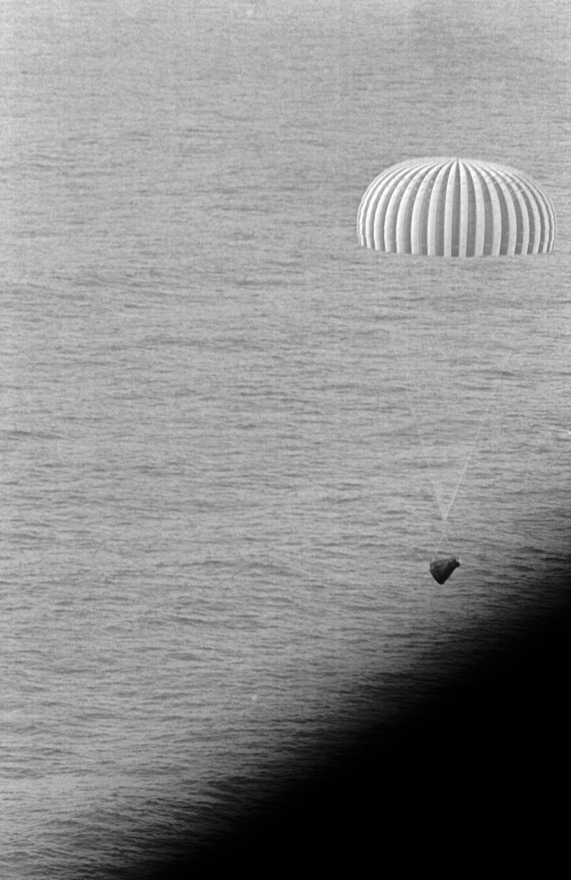 S66-42795 (21 July 1966) --- The Gemini-10 spacecraft, with astronauts John W. Young and Michael Collins aboard, nears touchdown in the Atlantic Ocean about four nautical miles from the prime recovery ship, USS Guadalcanal. Gemini-10 splashed down 460 nautical miles east of Cape Kennedy at 4:07 p.m. (EST), July 21, 1966, to conclude a three-day mission in space. Photo credit: NASA