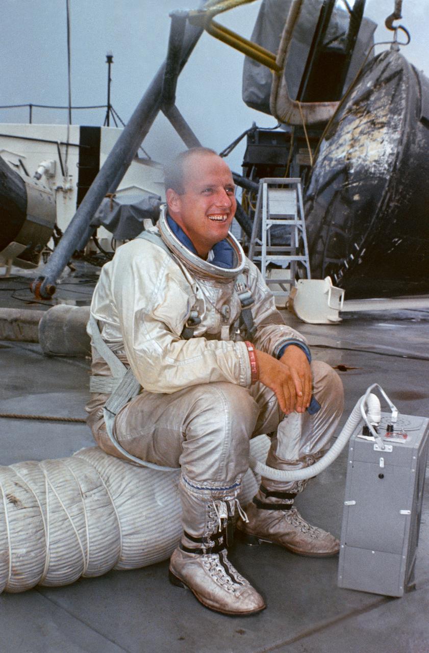S66-44501 (23 July 1966) --- Astronaut Charles Conrad Jr., prime crew command pilot of the Gemini-11 spaceflight, relaxes on deck of the NASA Motor Vessel Retriever after suiting up for water egress training in the Gulf of Mexico. Photo credit: NASA