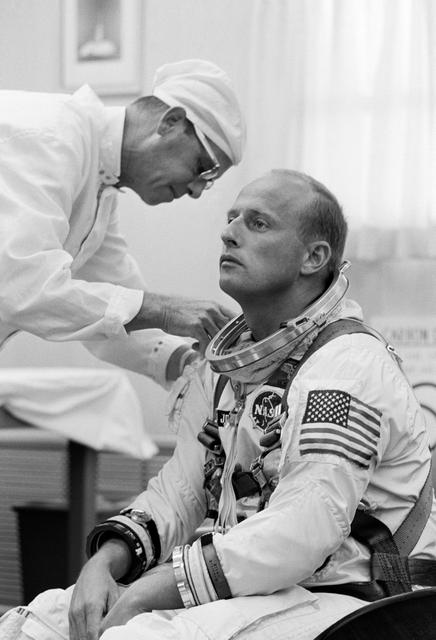 NASA image: Astronaut Charles Conrad, Jr. - Assistance - Suiting-Up - Pre-Mission - Cape