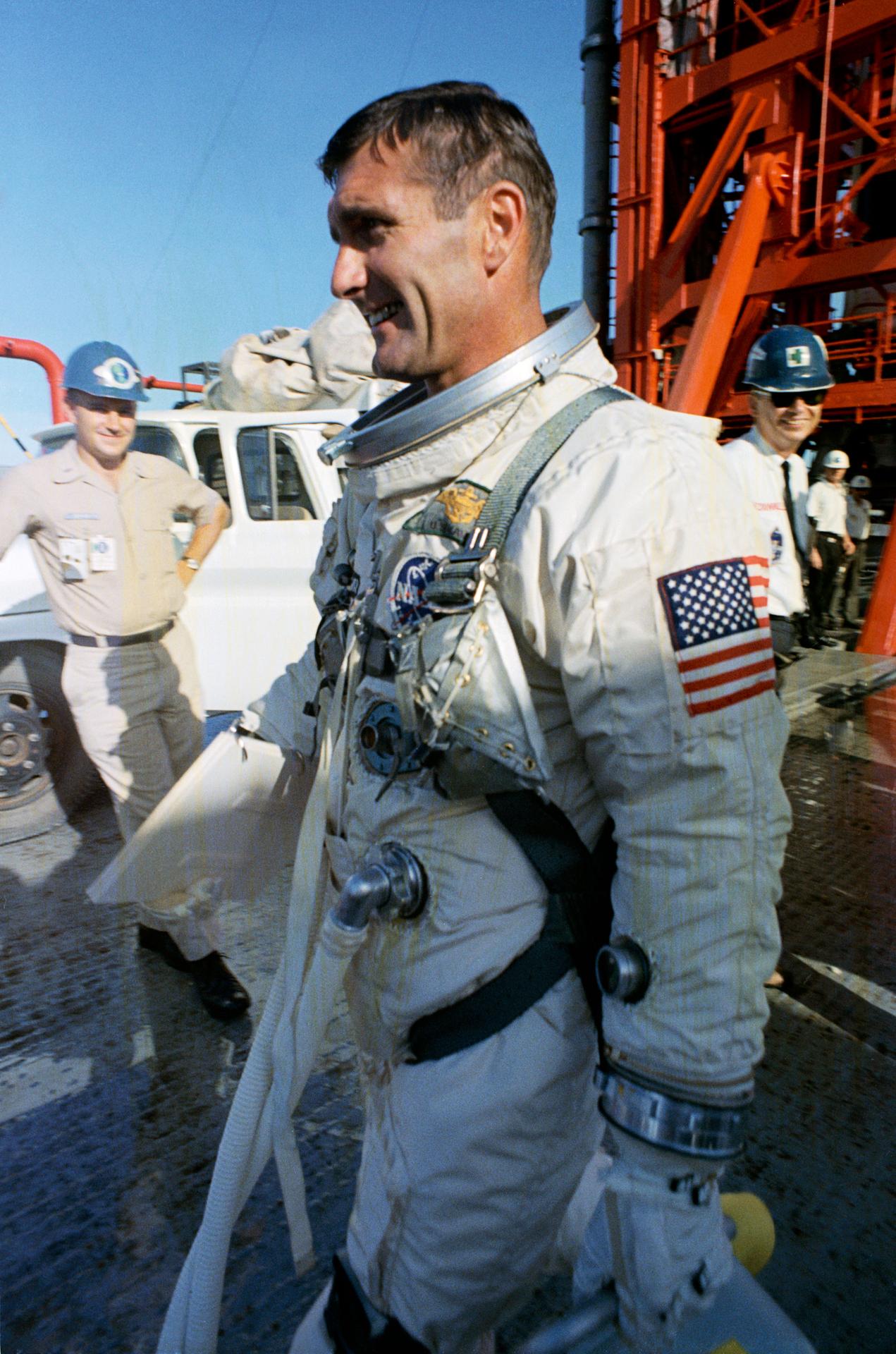 Astronaut Richard Gordon walks away from Pad 19 following postponement