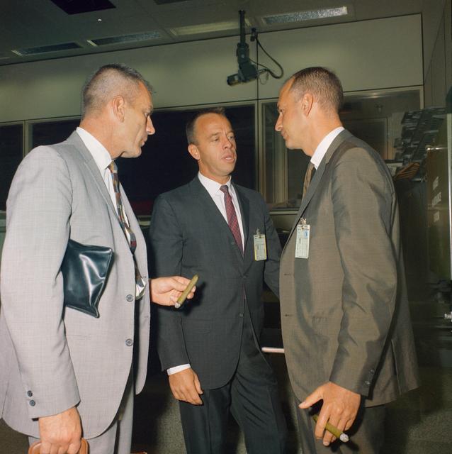 NASA image: Three MSC officials hold discussion in Mission Control room during Gemini 11