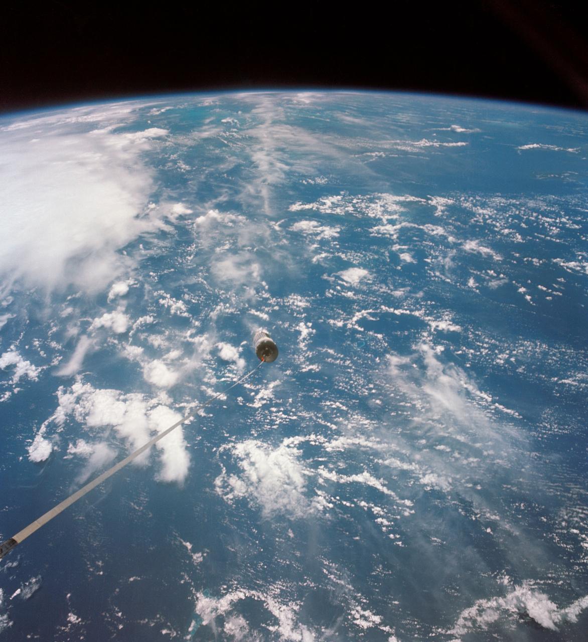 S66-54571 (14 Sept. 1966) --- A 100-foot tether line connects the Agena Target Docking Vehicle with the Gemini-11 spacecraft during its 32nd revolution of Earth. Photo credit: NASA