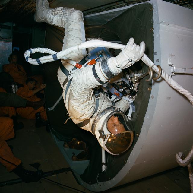 NASA image: Astronaut Edwin Aldrin practices tether attachment aboard KC-135