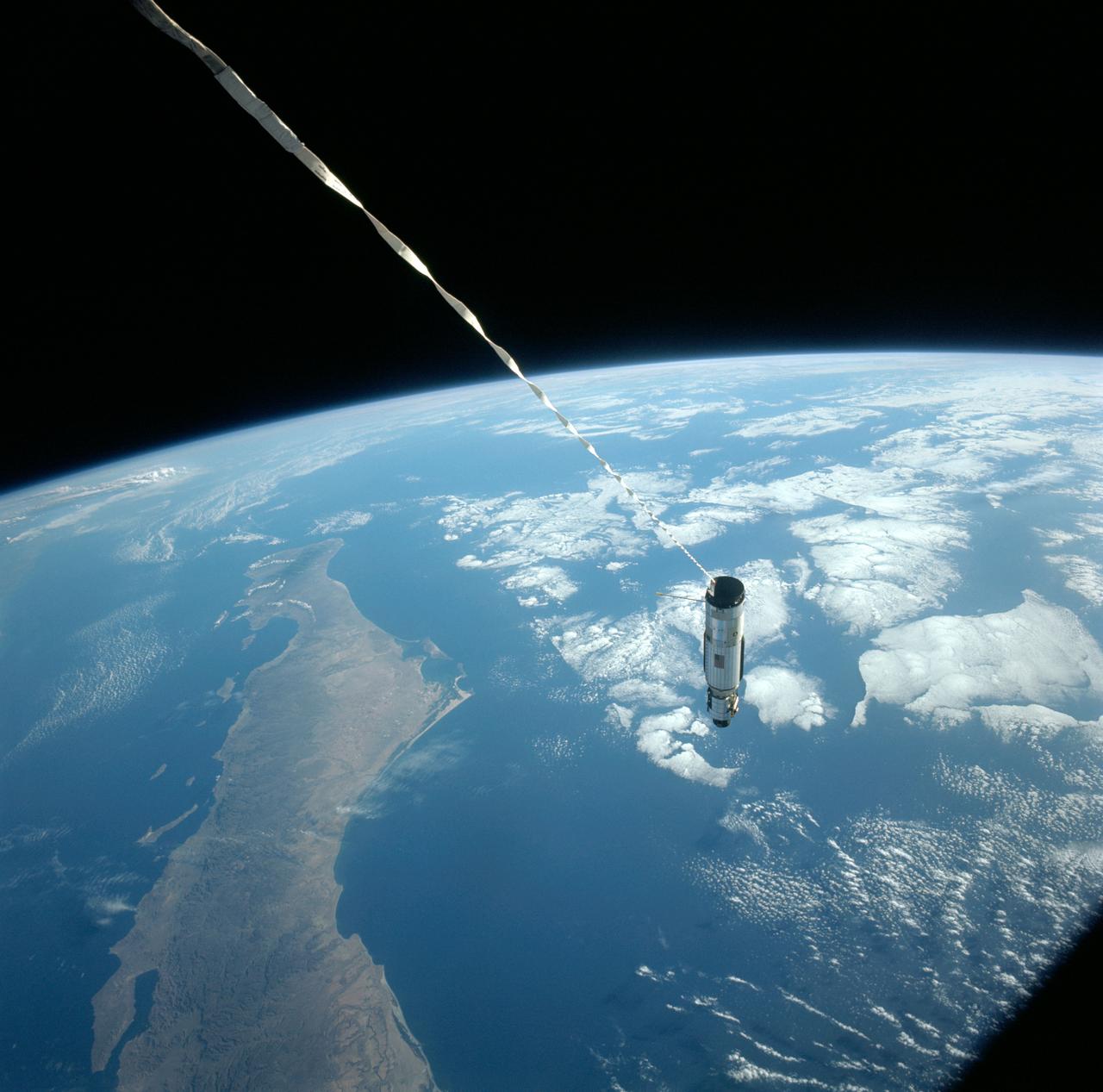 S66-63517 (13 Nov. 1966) --- The Gulf of California area as seen from the Gemini-12 spacecraft during its 30th revolution of Earth. Baja California Sur is the peninsula on the left. At lower left is the mainland of Mexico. A 100-foot tether line connects the Agena Target Docking Vehicle with the Gemini-12 spacecraft. View is looking south. Photo credit: NASA