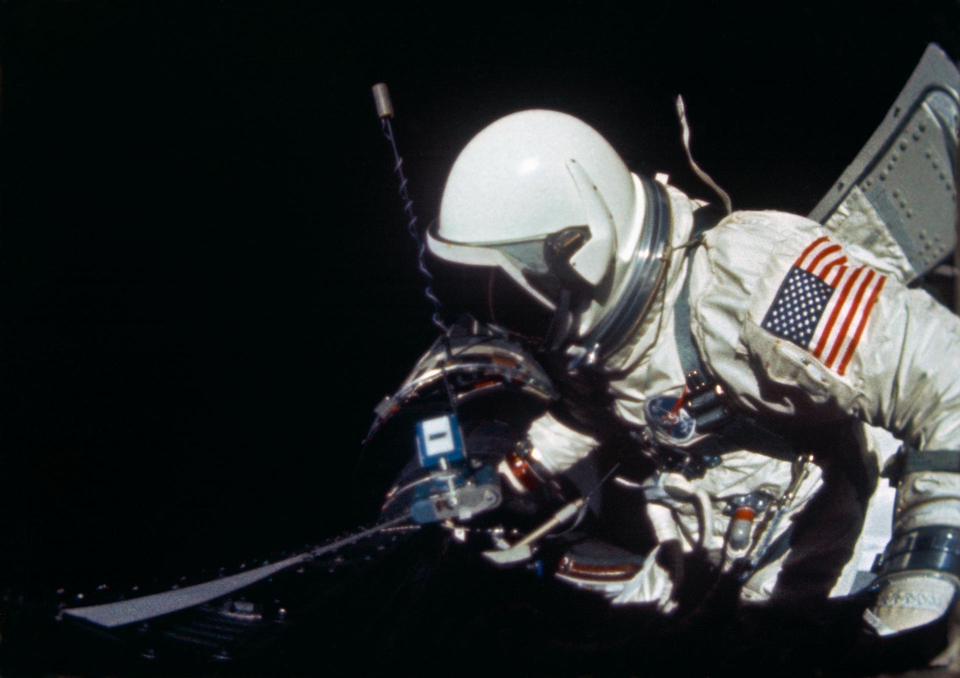 Buzz Aldrin begins a spacewalk for the Gemini 12 mission