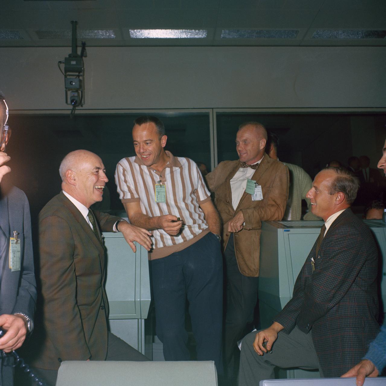 S66-64879 (15 Nov. 1966) --- Dr. Robert R. Gilruth (right), with astronauts, from the left, Charles Conrad Jr., John H. Glenn Jr. and Alan B. Shepard Jr. in Houston's Mission Control Center during the Gemini-12 mission. Photo credit: NASA