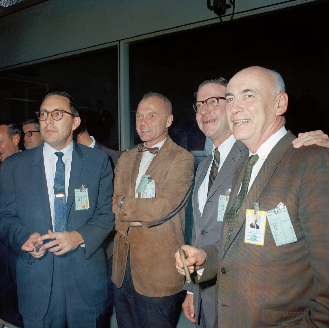 S66-64884 (15 Nov. 1966) --- Watching console activity in the Mission Control Center in Houston during the Gemini-12 splashdown (left to right), are Dr. Charles A. Berry, Director of Medical Research and Operations; astronaut John H. Glenn Jr.; James C. Elms, Director, NASA Electronics Research Center; and Dr. Robert R. Gilruth, Manned Spaceflight Center (MSC) Director.  Photo credit: NASA