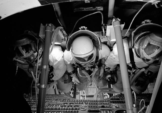 NASA image: Three astronauts inside Command Module Simulator during Apollo Simulation