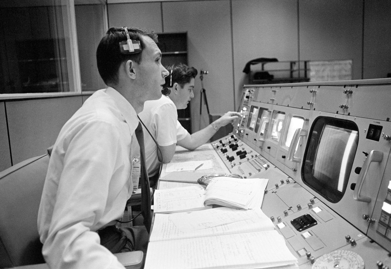 S68-50682 (October 1968) --- Public Affairs Office (PAO) commentator Douglas K. Ward is pictured at his console in the Mission Operations Control Room (MOCR) in the Mission Control Center at NASA's Johnson Space Center during the flight of Apollo 7. Photo credit: NASA