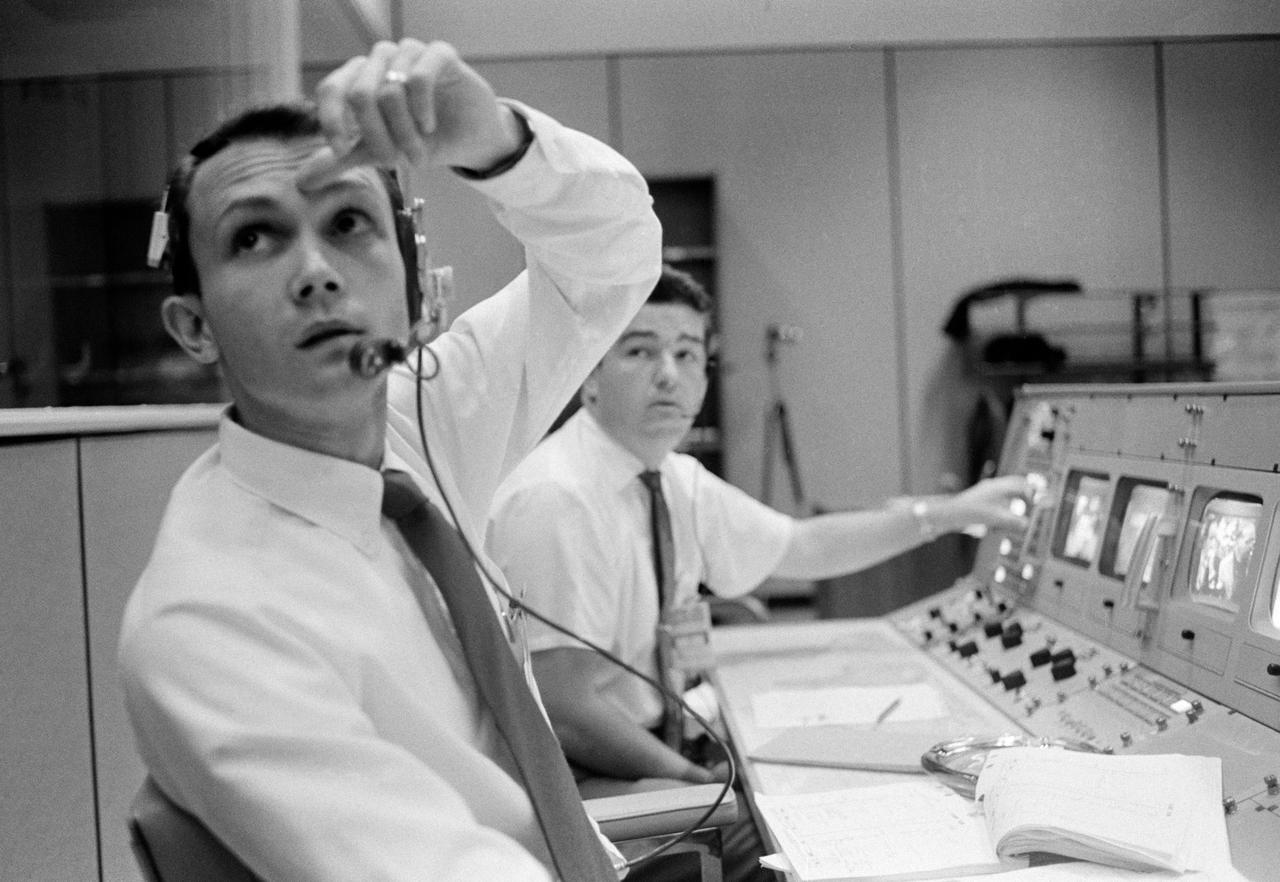 S68-50695 (October 1968) --- Public Affairs Office (PAO) commentator Douglas K. Ward is pictured at his console in the Mission Operations Control Room (MOCR) in the Mission Control Center at NASA's Johnson Space Center during the flight of Apollo 7. Photo credit: NASA