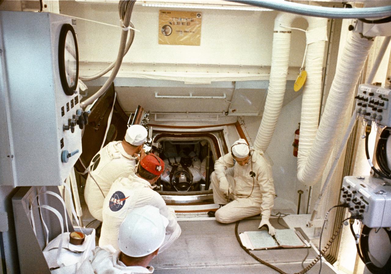 S69-35316 (18 May 1969) --- Interior view of the White Room at Pad B, Launch Complex 39, Kennedy Space Center, during the Apollo 10 prelaunch countdown. When this picture was taken the Apollo 10 crew had already been inserted into the spacecraft, and final checks were being made prior to closing of the hatch. Inside the Command Module were astronauts Thomas P. Stafford, commander; John W. Young, command module pilot; and Eugene A. Cernan, lunar module pilot. Liftoff for the lunar orbit mission was at 12:49 p.m. (EDT), May 18, 1969.