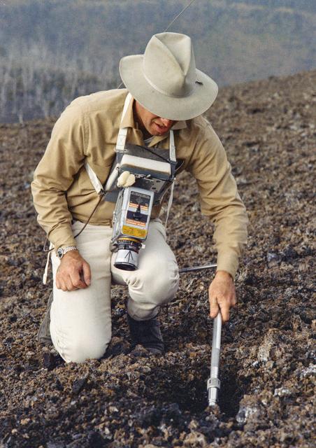 Astronauts James Lovell uses scoop from ALHT during simulation