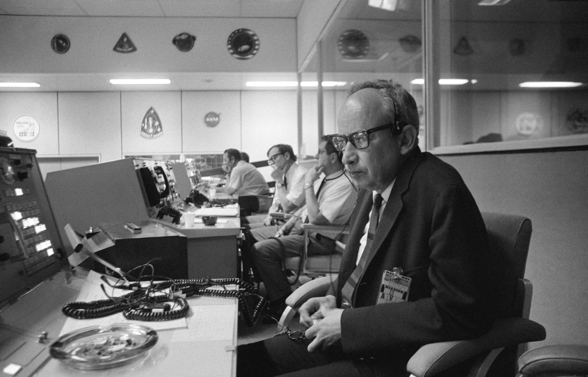 Sigurd A. Sjoberg, director of flight operations, at the Manned Spacecraft Center (MSC), views the Apollo 13 liftoff from a console in the MSC Mission Control Center (MCC), Building 30