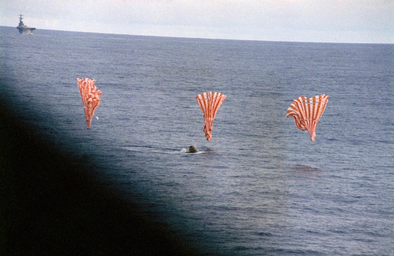 S70-35644 (17 April 1970) --- The Apollo 13 Command Module (CM) splashes down and its three main parachutes collapse, as the week-long problem-plagued Apollo 13 mission comes to a premature, but safe end. The spacecraft, with astronauts James A. Lovell Jr., commander; John L. Swigert Jr., command module pilot; and Fred W. Haise Jr., lunar module pilot, aboard splashed down at 12:07:44 p.m. (CST) April 17, 1970, in the South Pacific Ocean, only about four miles from the USS Iwo Jima, prime recovery ship.