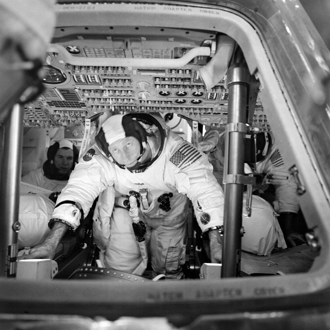 S71-29952 (26 March 1971) --- The three Apollo 15 prime crew members can be seen inside the Apollo 15 Command Module (CM) during simulation training at the Kennedy Space Center (KSC). Astronaut David R. Scott, commander, is in the background to the left. Astronaut Alfred M. Worden, center foreground, is the command module pilot. Out of view, to the right background, is astronaut James B. Irwin, lunar module pilot.