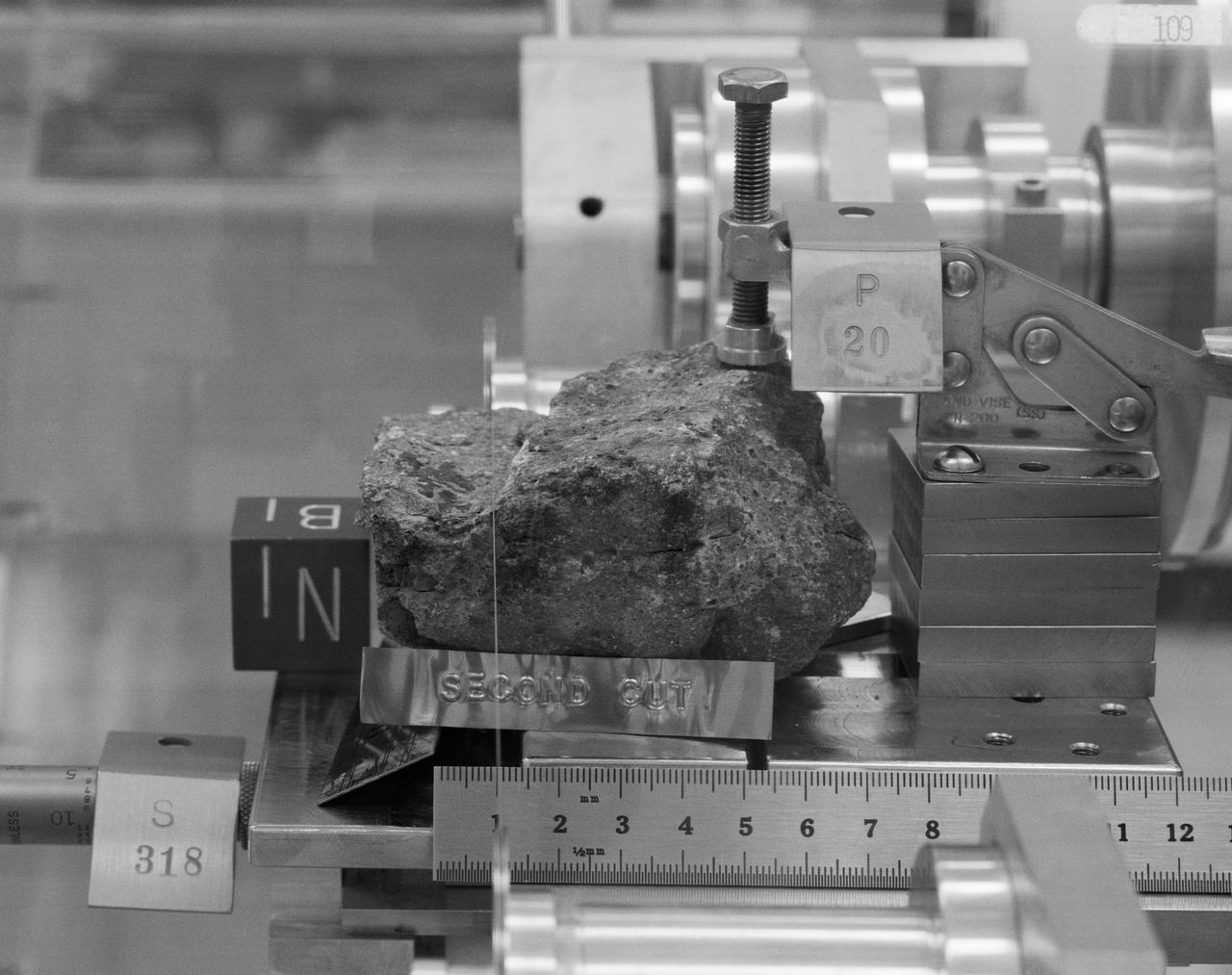 Generic: 14318. Mission: Apollo 14. Station: H. Landmark: NORTH BOULDER FIELD. BagNumber: Bag 1038. OriginalWeight: 600.2. SuperClass: Breccia. SubClass: Regolith. Category: ROCK. Classifications: VMB. Description: Vitric Matrix Breccia. Ipidesc: Breccia sample 14318 was collected from the regolith near the south end of North Boulder Field at Station H during the second EVA. It was returned in weigh bag 1038. Sample 14318 is one of the specimens chosen for study by the Imbrium Consortium, who received 14318,0. A complete set of matched thin sections, across the entire specimen was made by the Consortium (1976); This sample is a very coherent, gray, polymict breccia consisting of light gray clasts in a medium gray matrix. Classification 1: BRECCIA.