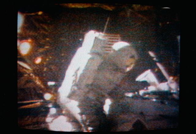 NASA image: Astronaut David Scott performs the act of cancelling the first Apollo 15 commemorative postage stamp