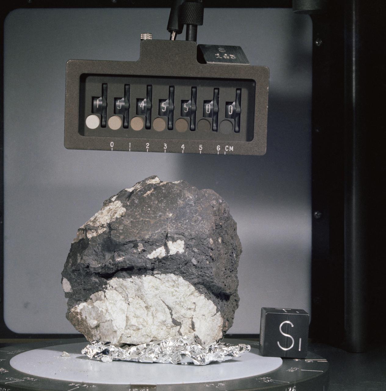 Generic: 15556. Mission: Apollo 15. Station: 9A. Landmark: HADLEY RILLE. BagNumber: SCB 2. OriginalWeight: 1542. SuperClass: Basalt. SubClass: Olivine. Category: ROCK. Classifications: F.G. ol-norm . Description: F.G. ol-norm. Classification 1: BASALT.