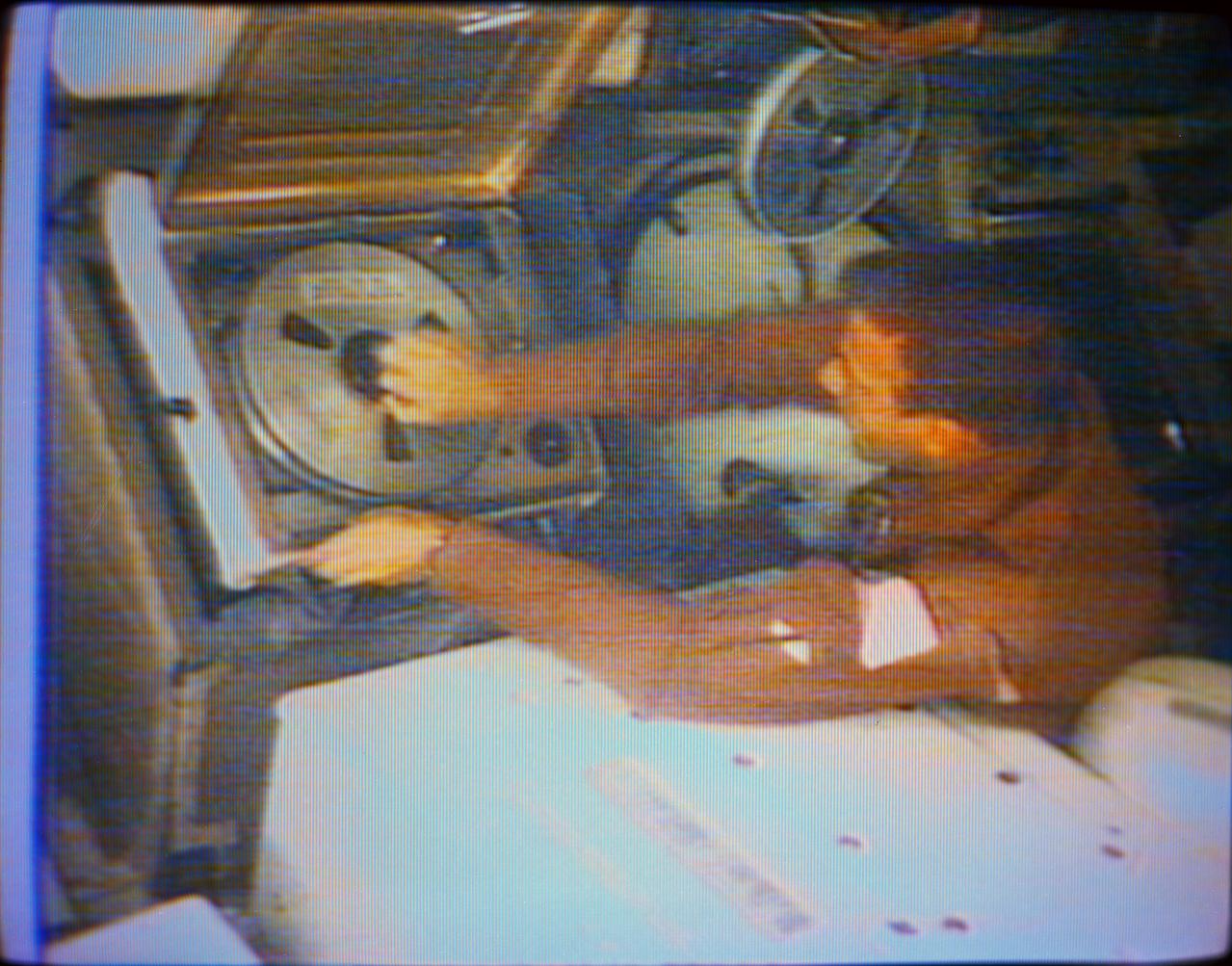 S73-27467 (5 June 1973) --- An overhead view of astronaut Paul J. Weitz, Skylab 2 pilot, at the video tape recorder in the Orbital Workshop of the Skylab 1 and 2 space station cluster in Earth orbit. Weitz is changing the tape in the recorder and storing the used data tape. This photograph was reproduced from a color television transmission made on June 5, 1973. Photo credit: NASA