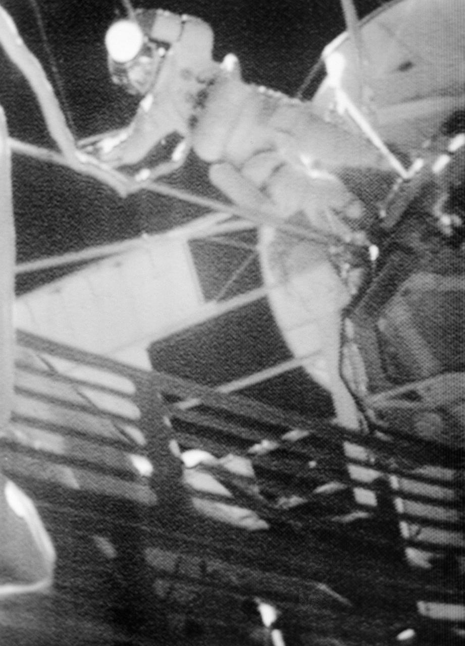 S73-31976 (5 Aug. 1973) --- Astronaut Jack R. Lousma, Skylab 3 pilot, is seen outside the Skylab space station in Earth orbit during the Aug. 5, 1973 Skylab 3 extravehicular activity (EVA) in this photographic reproduction taken from a television transmission made by a color TV camera aboard the space station. Scientist-astronaut Owen K. Garriott, Skylab 3 science pilot, participated in the EVA with Lousma. During the EVA the two crewmen deployed the twin pole solar shield to help shade the Orbital Workshop. Photo credit: NASA